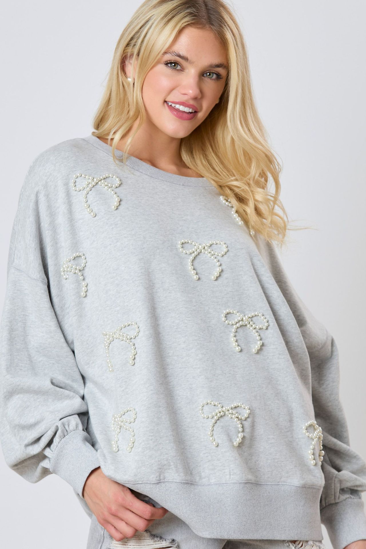Damen Herbst-Sweatshirt mit Langarm, Pullover-Design, Schleifendeko und Perlendetails
