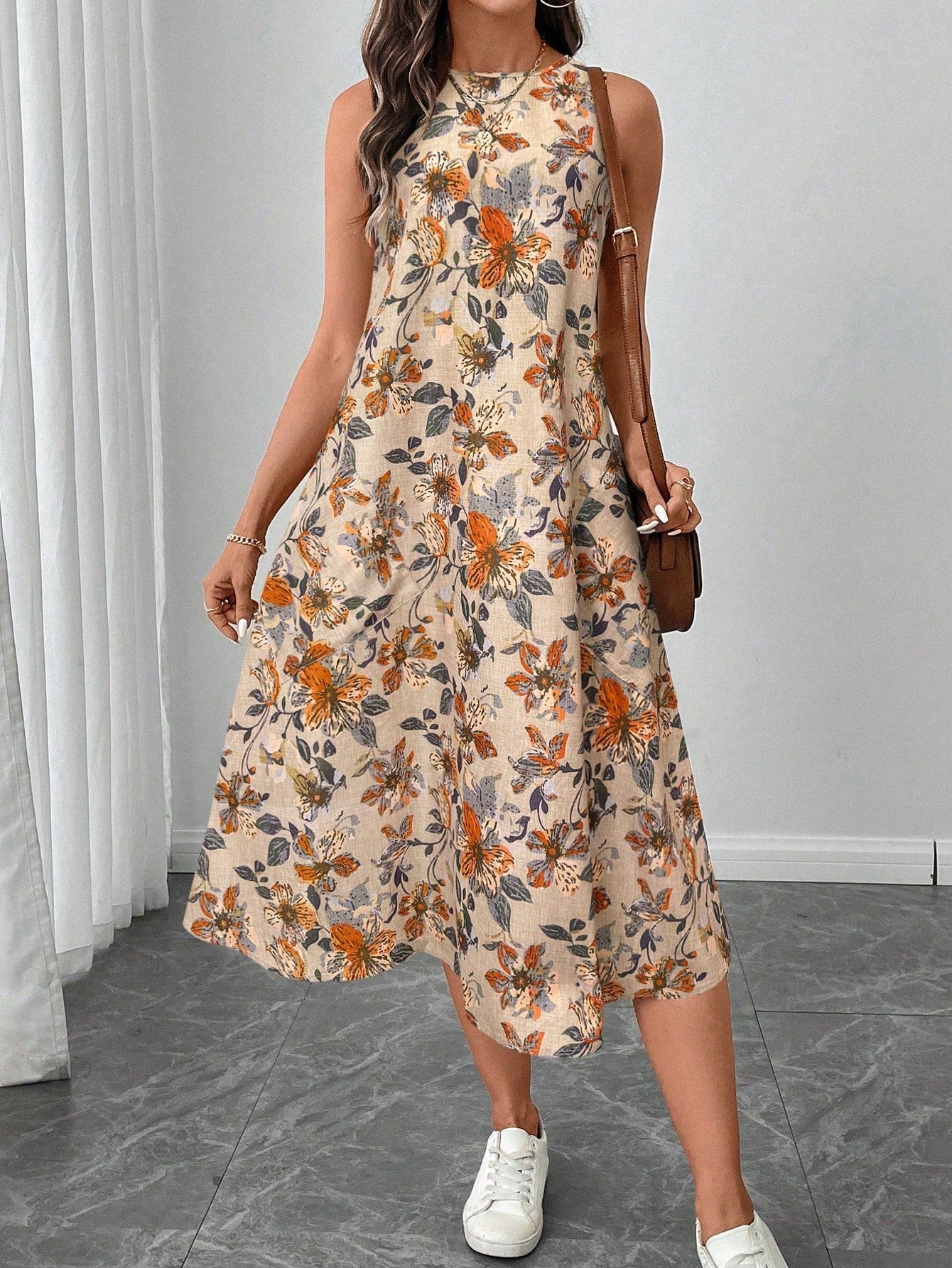 Ärmelloses Midi-Kleid mit Rundhalsausschnitt, floralem Muster und ausgestelltem Saum | Ideal für Frühling und Sommer