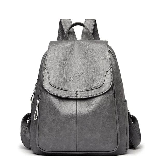 Grauer Leder-Rucksack mit Reißverschlüssen und verstellbaren Trägern, ideal für Damen. Stilvoller, praktischer Tagesrucksack für Schule oder Arbeit.