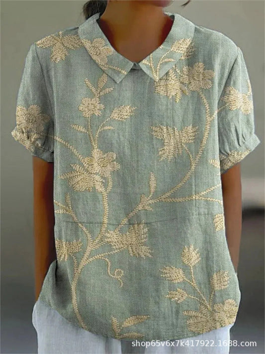 Damenbluse mit floralen Stickereien, kurzärmelig, grün-beige, lässiger Stil, ideal für Sommermode und Freizeitkleidung.