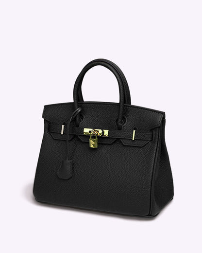 Luxuriöse schwarze Lederhandtasche mit goldener Schnalle und Henkeln, elegantes Design, Damenmode-Accessoire, stilvoll und zeitlos.
