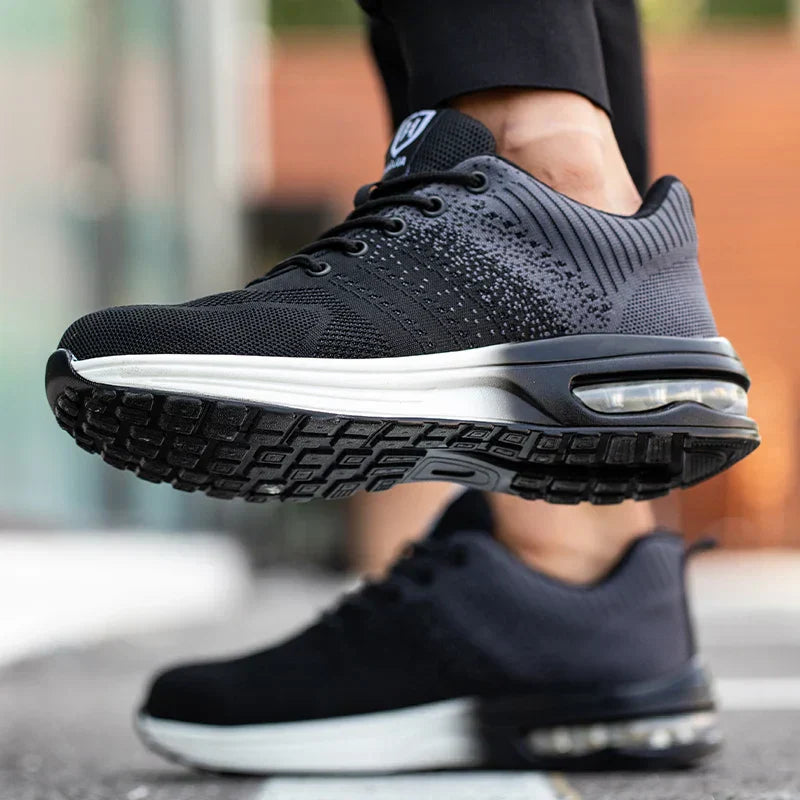 Schwarze Sportschuhe mit Luftpolstersohle, ideal für Laufen und Fitness. Moderne, rutschfeste Sohle, atmungsaktives Material, stilvolles Design.