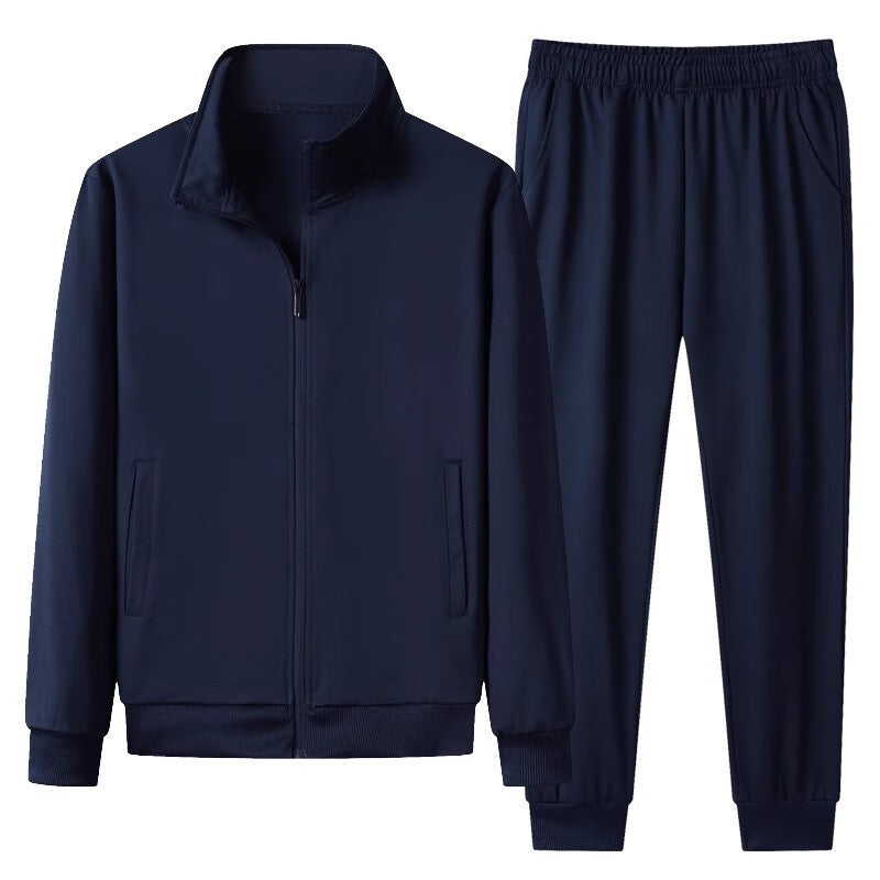 Dunkelblauer Trainingsanzug für Herren, bestehend aus Jacke mit Reißverschluss und elastischer Hose. Sportbekleidung, Freizeitmode, Herrenmode.