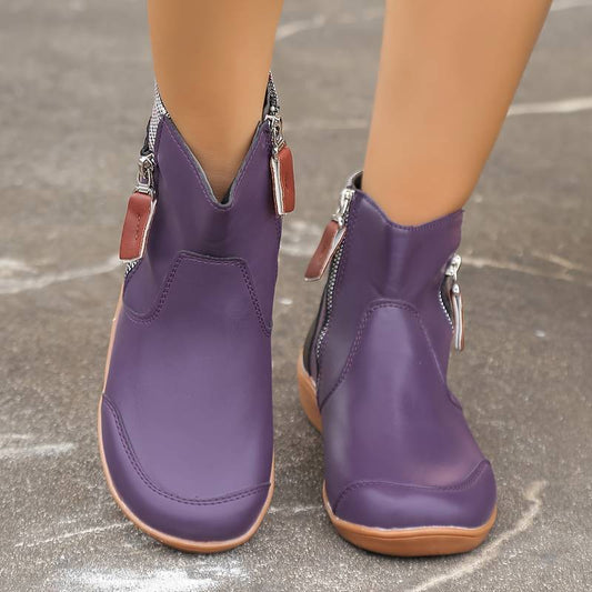 Lila Damenstiefeletten mit Reißverschluss, modisches Design, bequeme Passform, ideal für Herbstmode, stilvolle Schuhe für Frauen.
