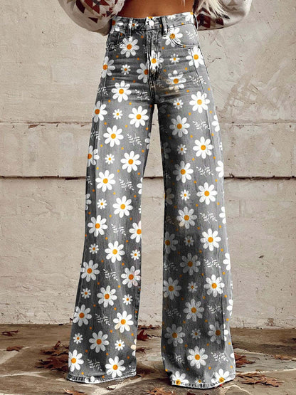 Graue Schlaghose mit weißem Gänseblümchenmuster, modisch und retro, ideal für trendige Frühlings- und Sommeroutfits.