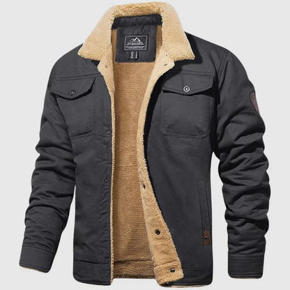 Schwarze Herrenjacke mit beigem Fleecefutter, zwei Brusttaschen und Knopfverschluss. Winterjacke, warm, modisch, Outdoor-Bekleidung.