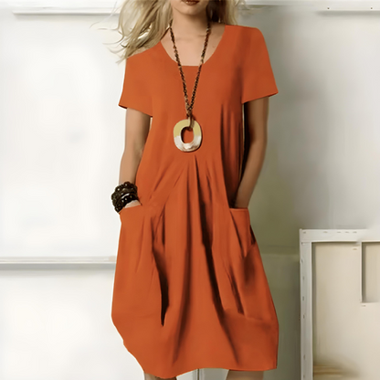 Damenkleid mit Rundhalsausschnitt und lockerem Schnitt zur Bauchkaschierung
